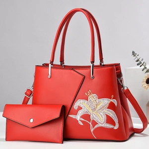 Elegant red tote bag with white lily embroidery and matching envelope wallet set