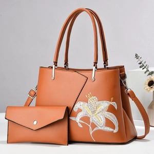 Minimalist tan leather crossbody bag set with white lily floral embroidery and pouch