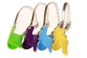 Detail of colorful silicone duck-shaped dog muzzles with adjustable leather straps