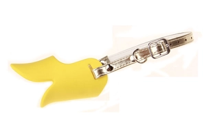 Detail of yellow silicone duck beak dog muzzle with adjustable gold leather strap