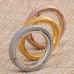 Close-up of 4mm mesh texture stainless steel rings in silver, gold, and rose gold