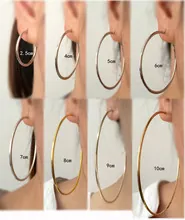 Visual size comparison of punk hoop earrings from 2.5cm to 10cm on model for reference