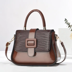 Elegant brown patent leather crossbody bag with crocodile texture and gold buckle