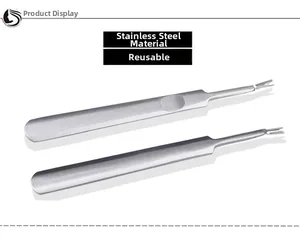 Macro view of stainless steel nail cuticle pushers with non-slip handles for manicure