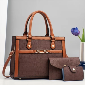 Three-piece brown crocodile pattern handbag set with tote, envelope pouch, and card holder