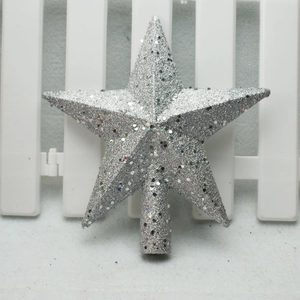 Close-up of a silver glittered star tree topper with a cylindrical base for Christmas trees