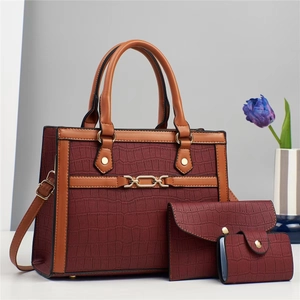 Three-piece burgundy crocodile pattern tote bag set with elegant gold-tone hardware
