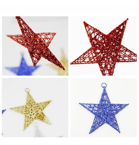Detail of glittered iron star ornaments showing hollow woven texture and hanging loops