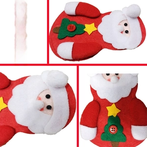 Close-up of handmade felt Santa pouch with stitched green tree and yellow star detail
