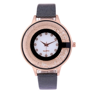 Detail of rose gold watch face with quartz movement and sparkling crystal embellishments