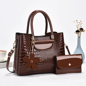 Dark brown crocodile embossed leather tote bag and matching wallet with flower charm