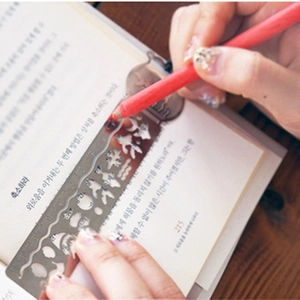 Multi-functional metal hollow-out bookmark ruler with 10cm scale and drawing icons