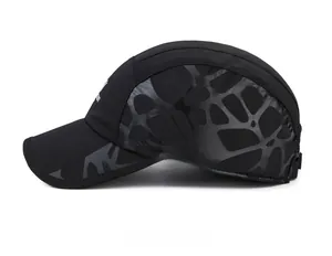 Detail of black winter baseball cap showing side honeycomb texture and printed logo