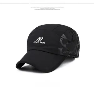 Close-up of black winter baseball cap featuring reflective leopard pattern and side logo