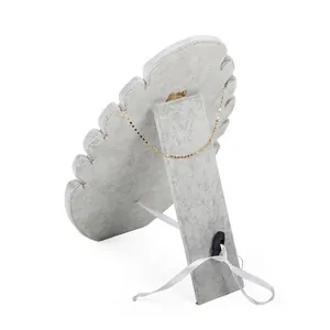 Gray velvet flame shaped jewelry display board with foldable stand and neck notches