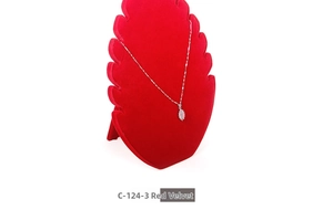 Detail of red velvet flame necklace display stand showing wave notches for jewelry