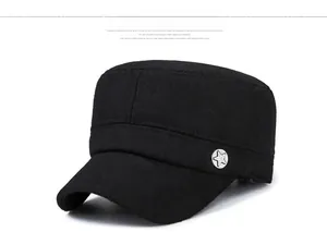 Detail shot of a black wool cadet cap featuring a metallic silver star emblem