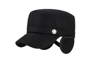 Detail view of winter wool flat cap featuring foldable earflaps and star metal emblem