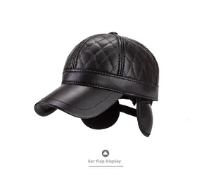 Detail view of winter earflap baseball cap with diamond-quilted faux leather texture