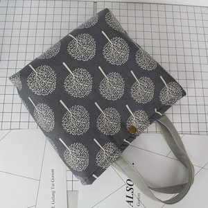 Dark gray cotton linen bento bag with white tree pattern and bronze buckle closure