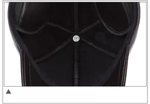 Detail shot of the multi-panel stitched inner lining and silver metal buckle of the leather hat