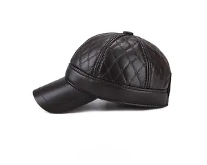 Detail view of deep brown quilted PU leather baseball cap with diamond stitching