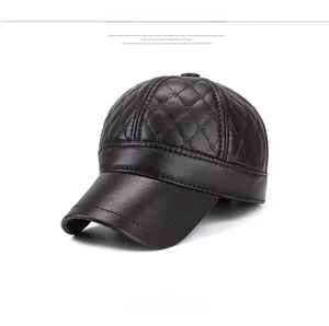 Detail view of dark brown leather baseball cap with diamond quilted stitching patterns