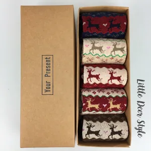 Close-up of a 5-pair Christmas wool socks gift box with reindeer and snowflake patterns