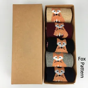 Close-up of five pairs of wool fox pattern socks packed in a premium craft gift box