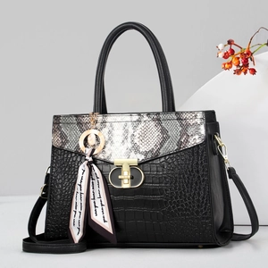 Black crocodile-textured handbag with snakeskin pattern flap and decorative silk scarf