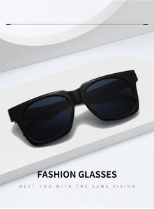 Detail view of black square fashion sunglasses on a minimalist geometric pedestal