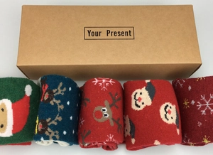 Detailed view of 5-pack wool Christmas socks with deer patterns in a kraft gift box