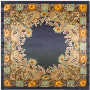 Detail of silk scarf showing deep blue paisley patterns and smooth satin texture