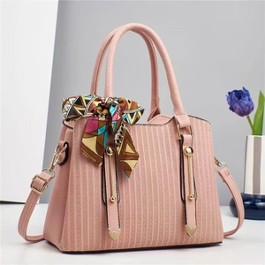 Pink lychee grain leather handbag with decorative silk scarf and gold metal hardware