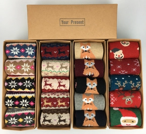 Christmas wool socks gift set with deer and snowflake patterns in a brown paper box