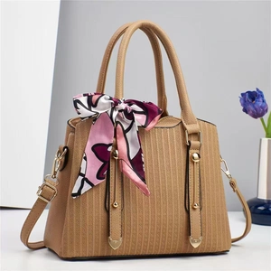 Chic khaki faux leather handbag with floral scarf and gold pendants for women