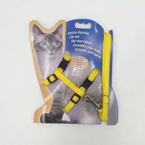 Detailed view of yellow nylon cat harness and leash set with adjustable metal buckle packaging