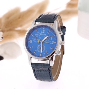 Detail of Geneva A879 silver watch with blue leather strap and Roman numeral dial