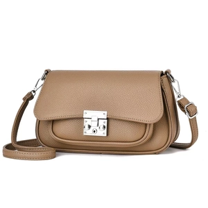 Classic tan lychee leather crossbody bag with silver push-lock and adjustable strap