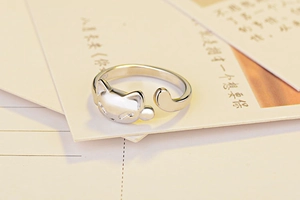 Macro shot of S925 sterling silver stamp on minimalist adjustable cat-shaped ring