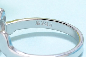 Macro view of S925 sterling silver hallmark engraved on the inner band of the cat ring