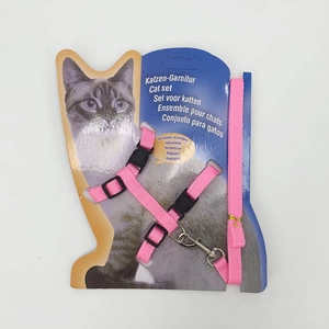 Detailed view of pink nylon cat harness and leash set on retail display card