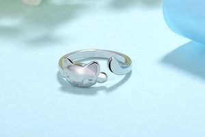 Detailed close-up of cute silver cat open ring with adjustable tail design features