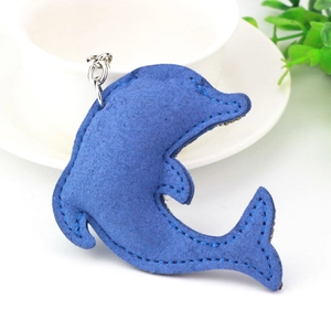 Detail of blue suede dolphin keychain featuring silver metal clasp and fine stitching