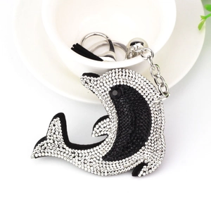 Dolphin keychain with black and white crystals on a silver metal chain for bags