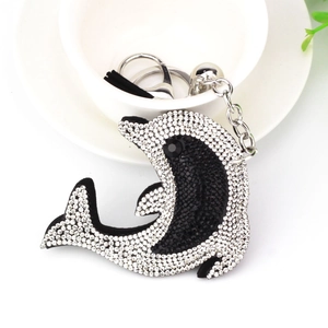 Detail of dolphin bag charm with black and white rhinestones and silver key ring