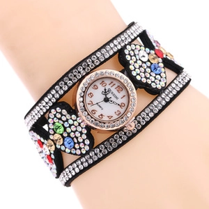 Detail of quartz watch featuring multilayer leather band with heart rhinestones