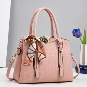 Pink stone pattern bucket bag with gold hardware and decorative silk scarf detail