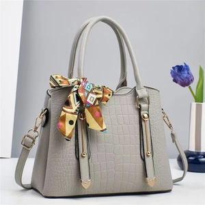 Gray crocodile texture handbag with gold hardware and colorful decorative silk scarf
