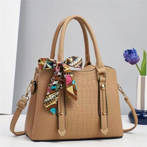 Beige faux crocodile leather handbag with colorful silk scarf and detachable strap